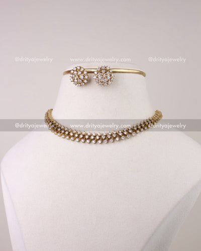 SKU 1304 - Necklace set styled as short necklace with studs on display bust