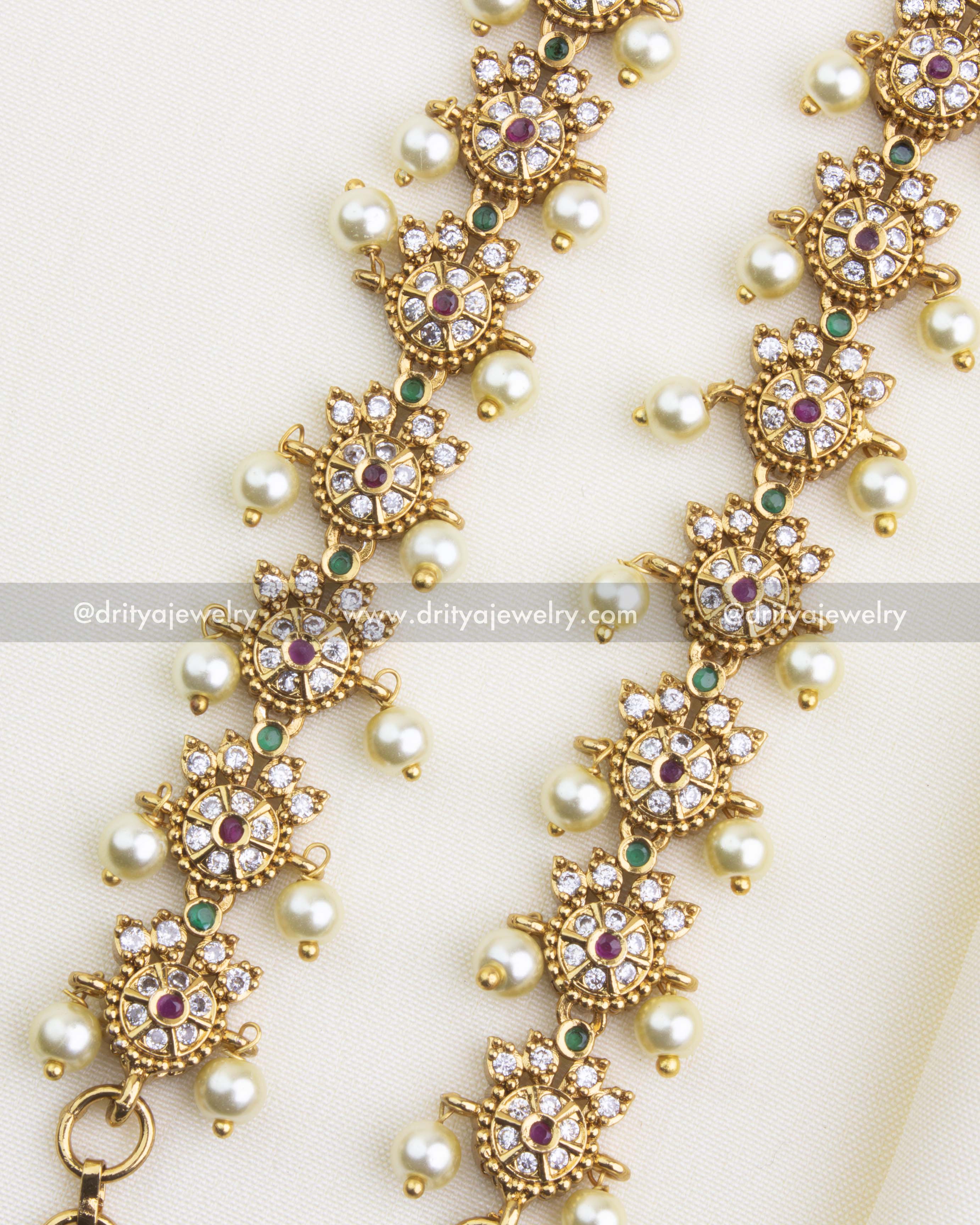 Close-up of SKU 1137 antique gold CZ stone anklet pair with pearl drops, top view