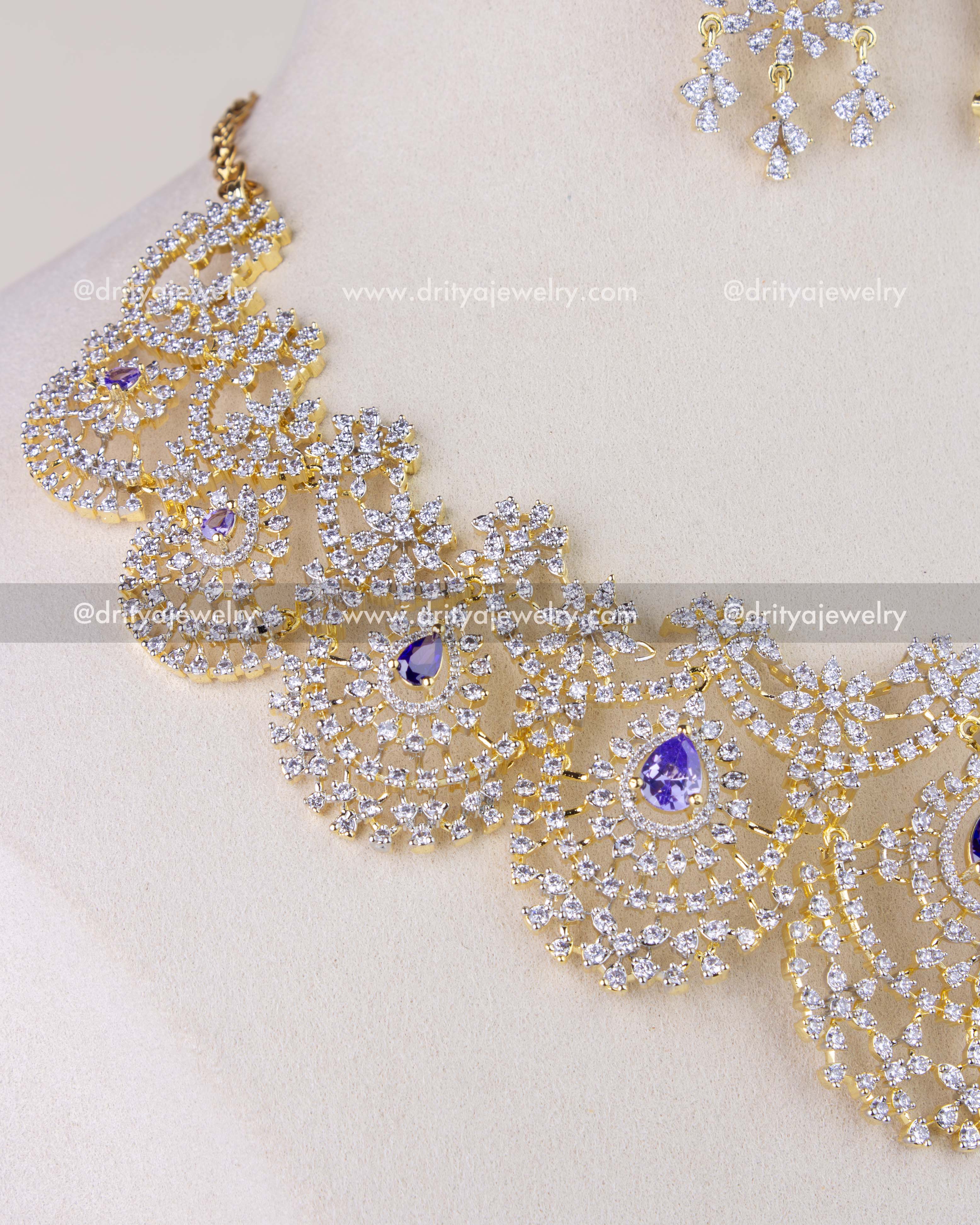 1278-PU close-up of stone-studded scalloped necklace design with purple center stones