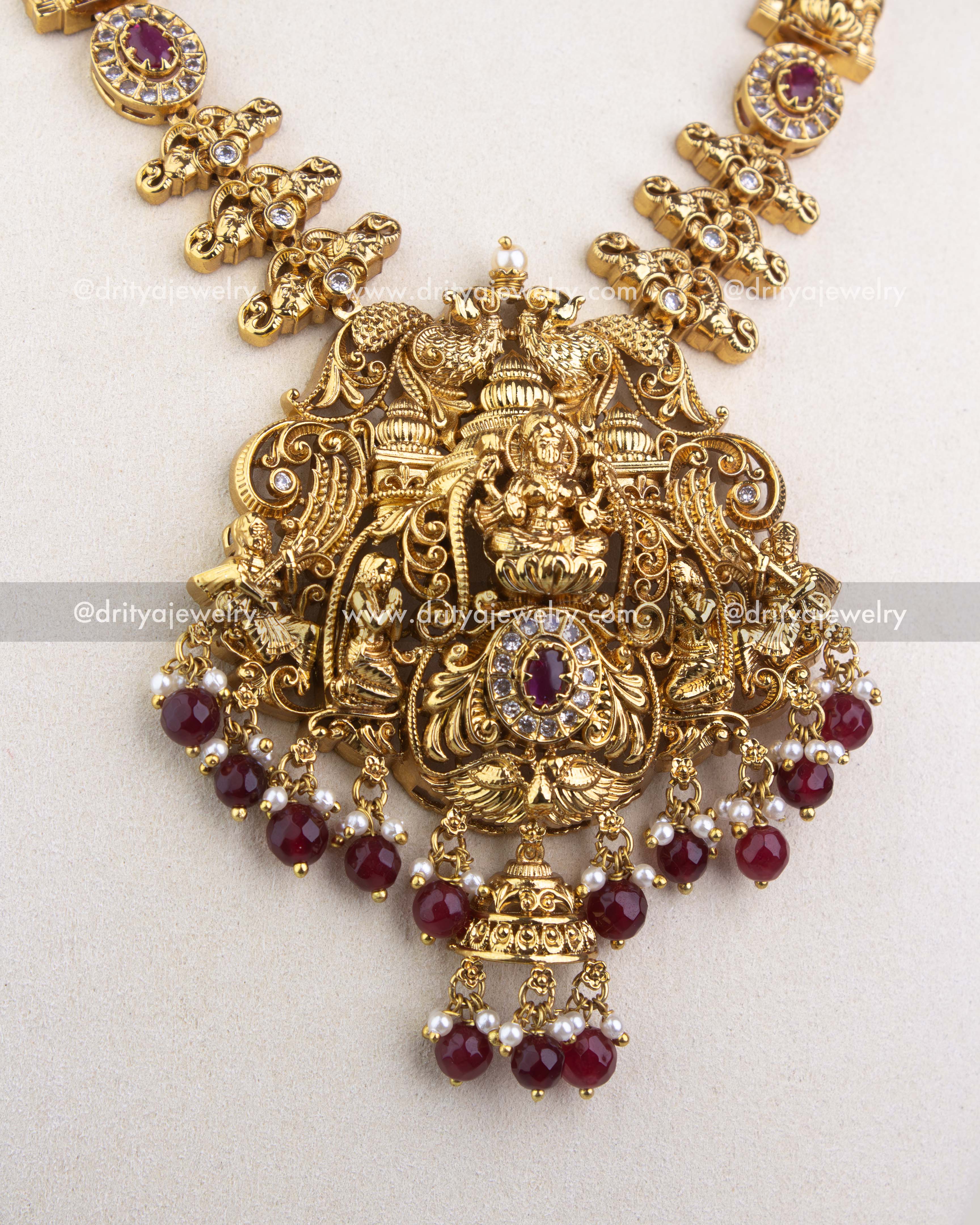 1240-R close-up of Lakshmi temple pendant with ruby red and pearl bead drops
