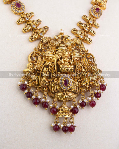 1240-R close-up of Lakshmi temple pendant with ruby red and pearl bead drops