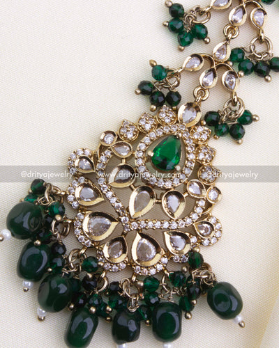 1133-G close-up of emerald maang tikka centerpiece with teardrop stones and bead hangings