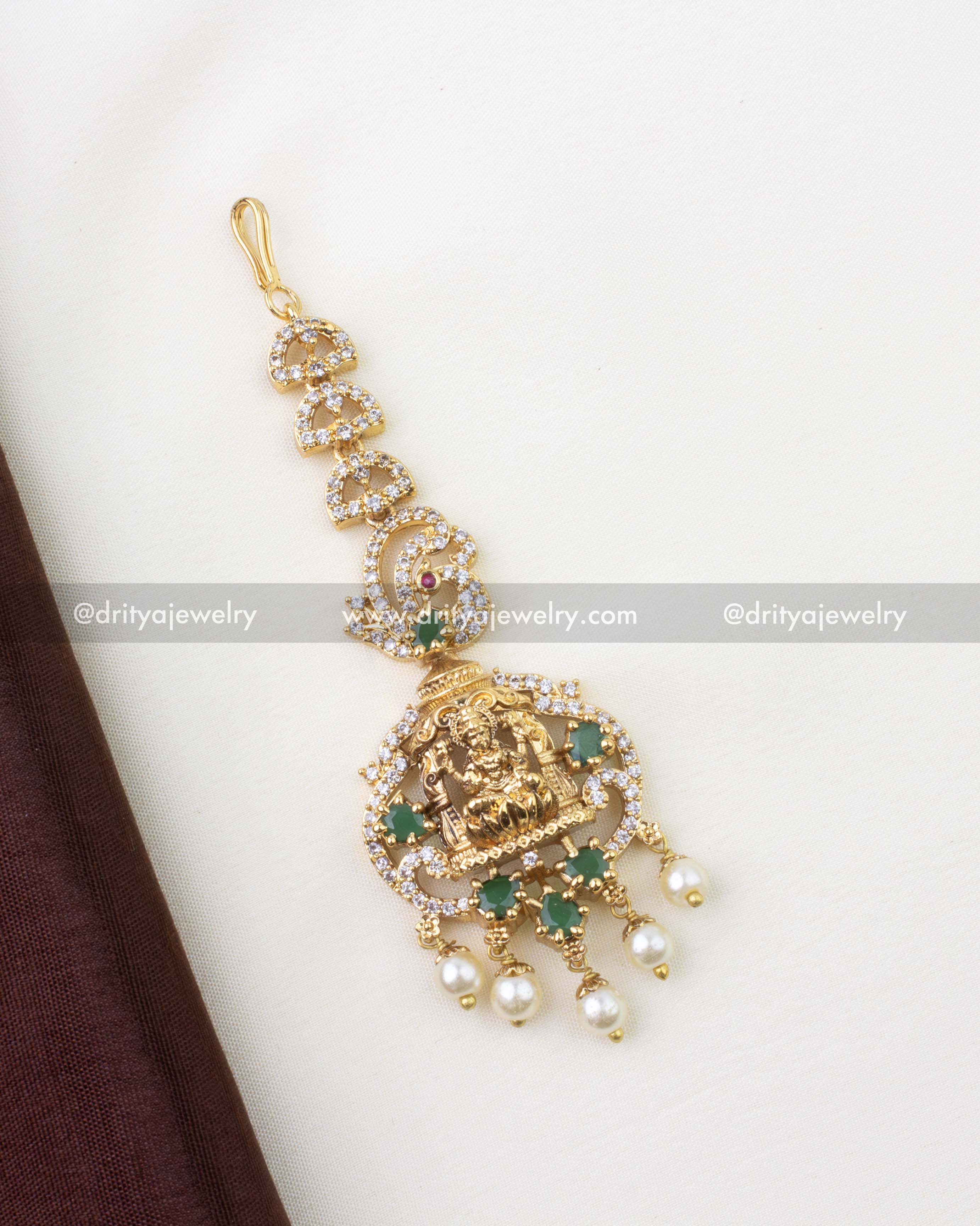 1297-G temple god idol maang tikka full view with emerald stones and pearl drops
