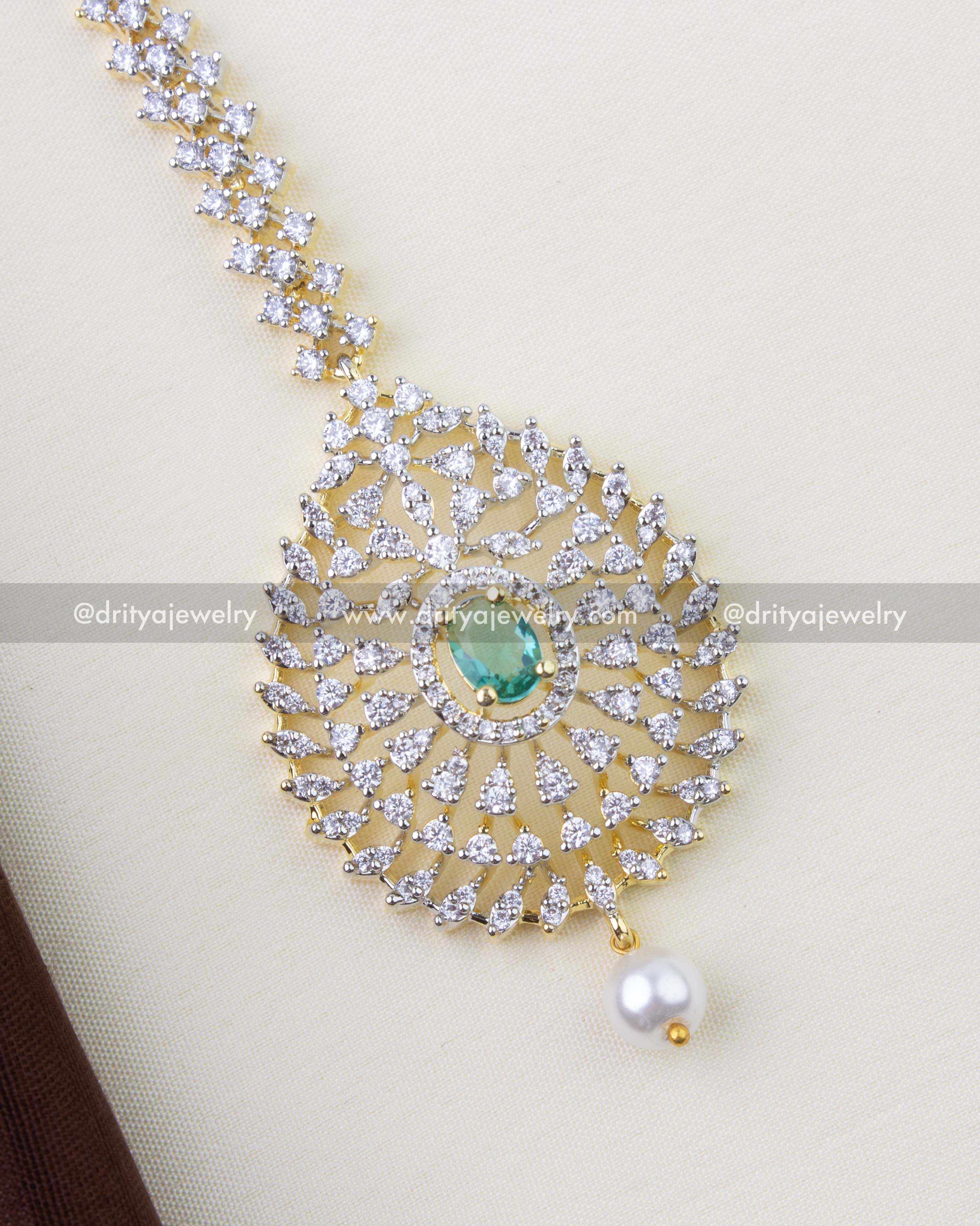 1293-RE close-up of Russian emerald centre and CZ detailing on maang tikka