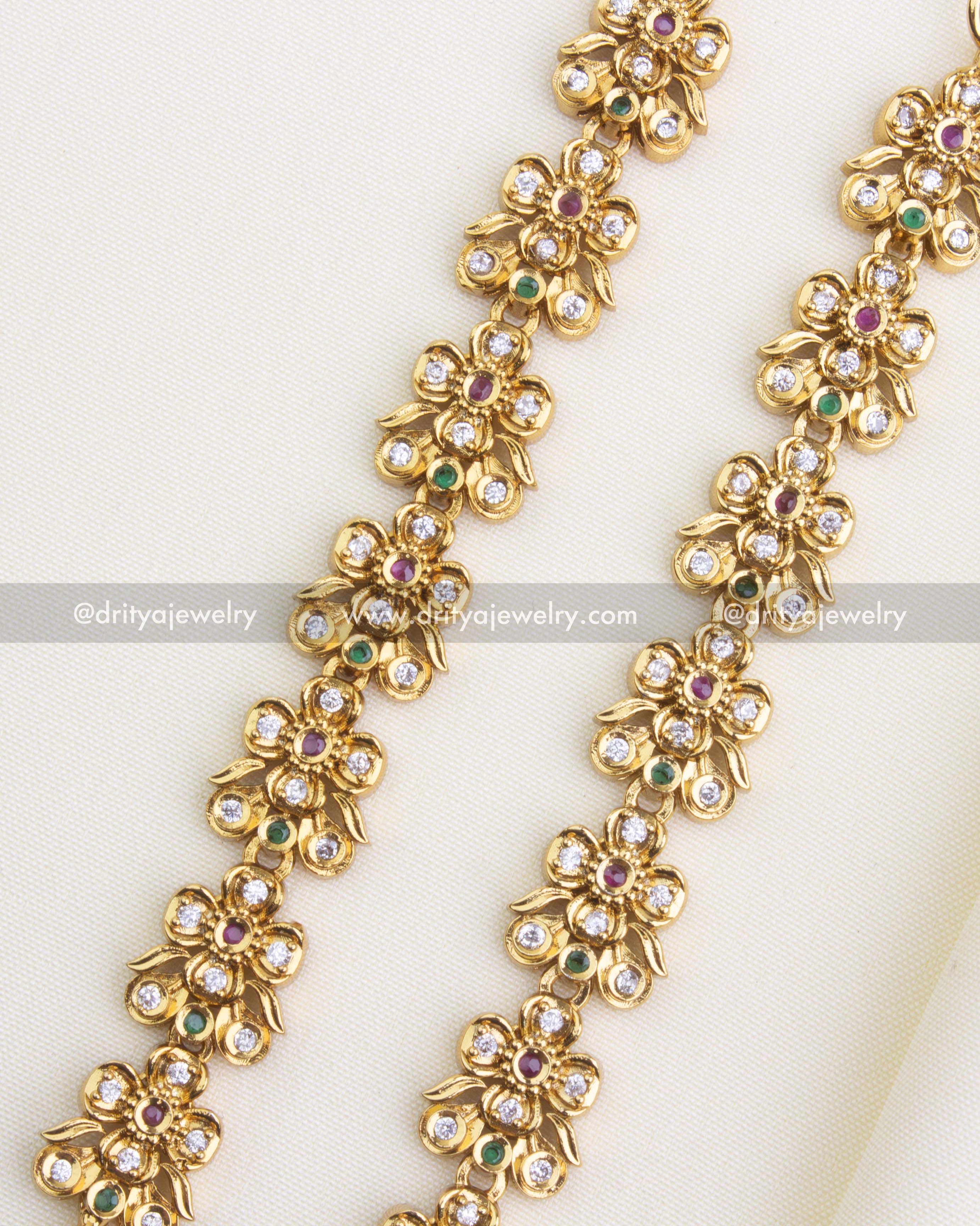 SKU 1146 close-up of antique floral CZ maang tikka pair showing stone detailing