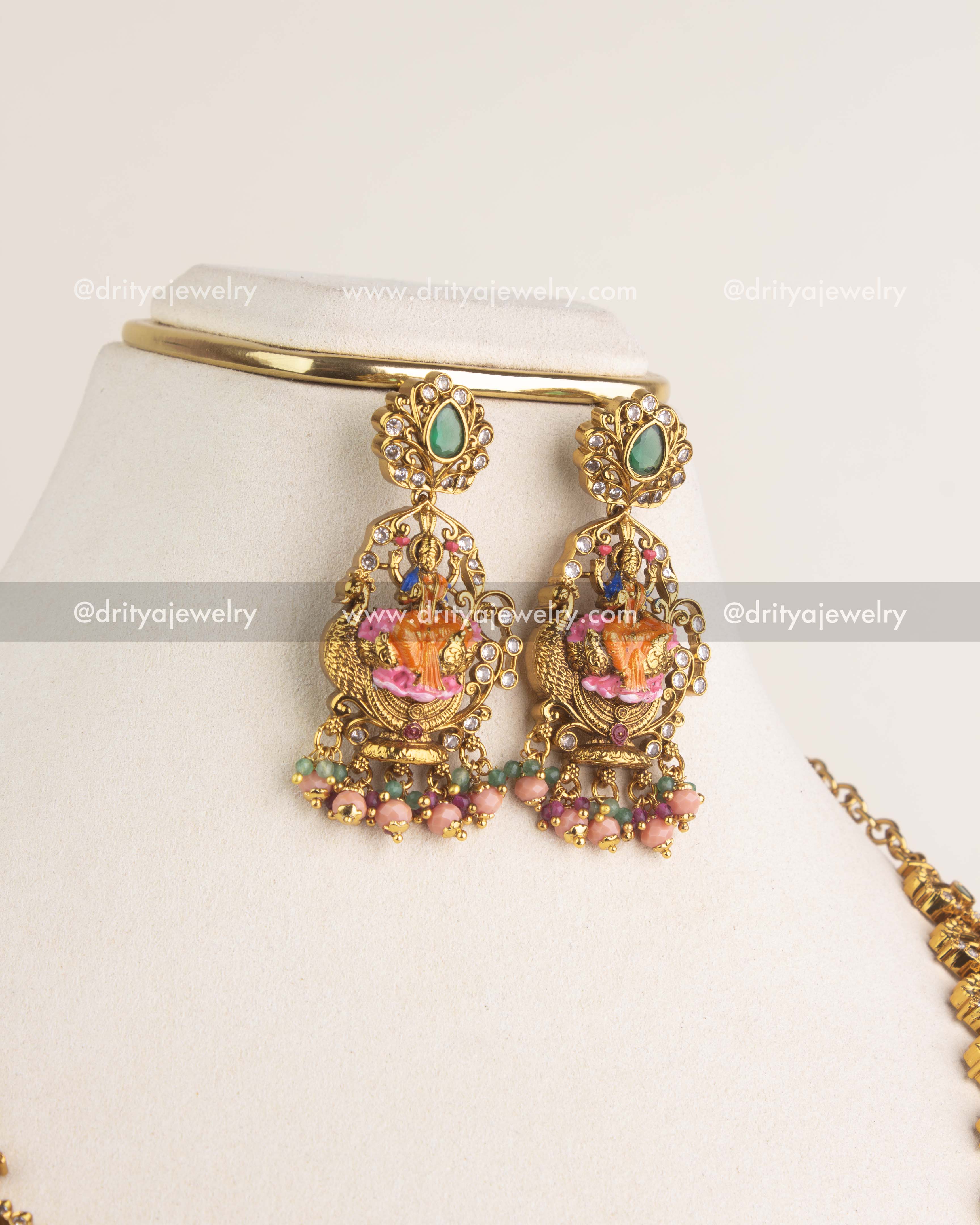 1197 Necklace Set close-up of god idol earrings with meenakari work and bead drops