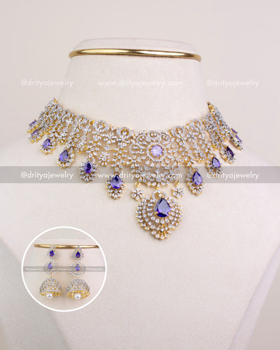 Premium purple stone CZ short necklace with matching jhumka earrings displayed on bust, front view