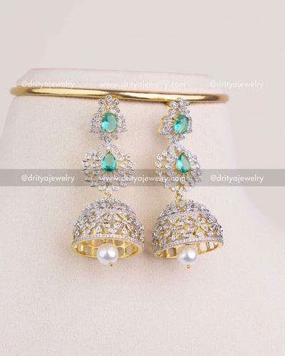 1227 - Close-up of big CZ and emerald toned jhumka earrings
