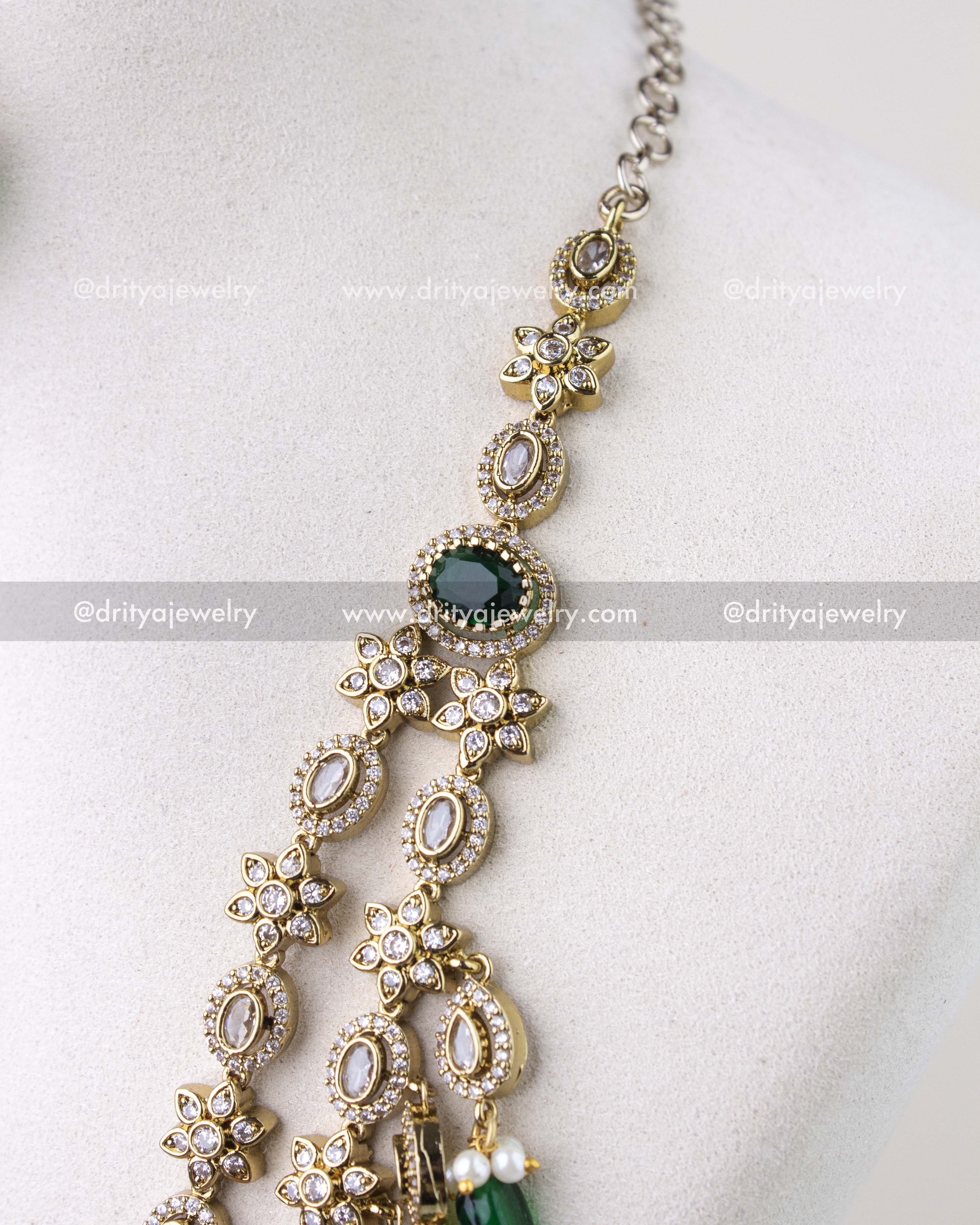 1309-GL close-up of layered necklace side segment with floral CZ motifs