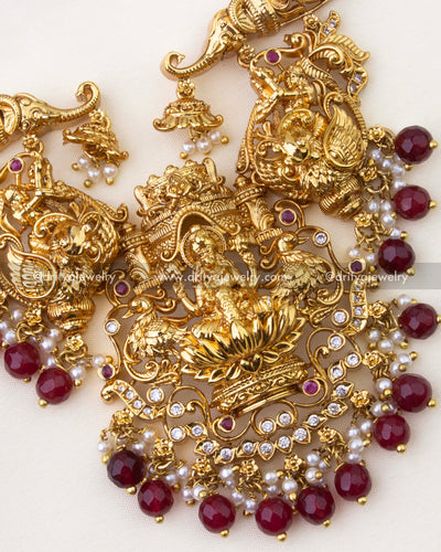 1263-R detailed view of god idol pendant with ruby beads and pearl-like drops