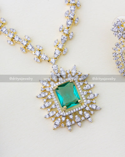 1276-RE close-up of emerald pendant with diamond replica halo on chain