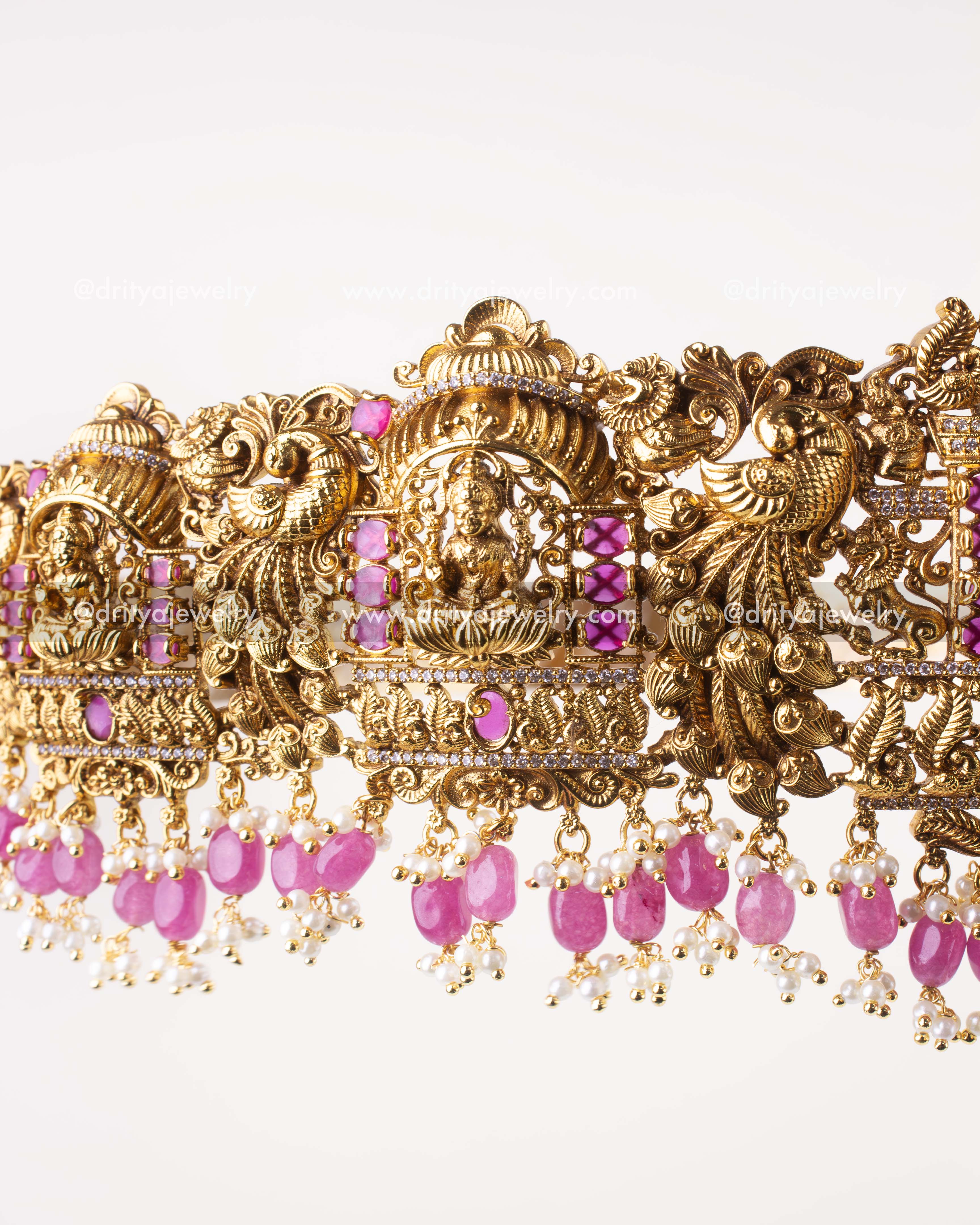 1207-WB close-up of Lakshmi Devi panel with ruby pink stones and bead drops