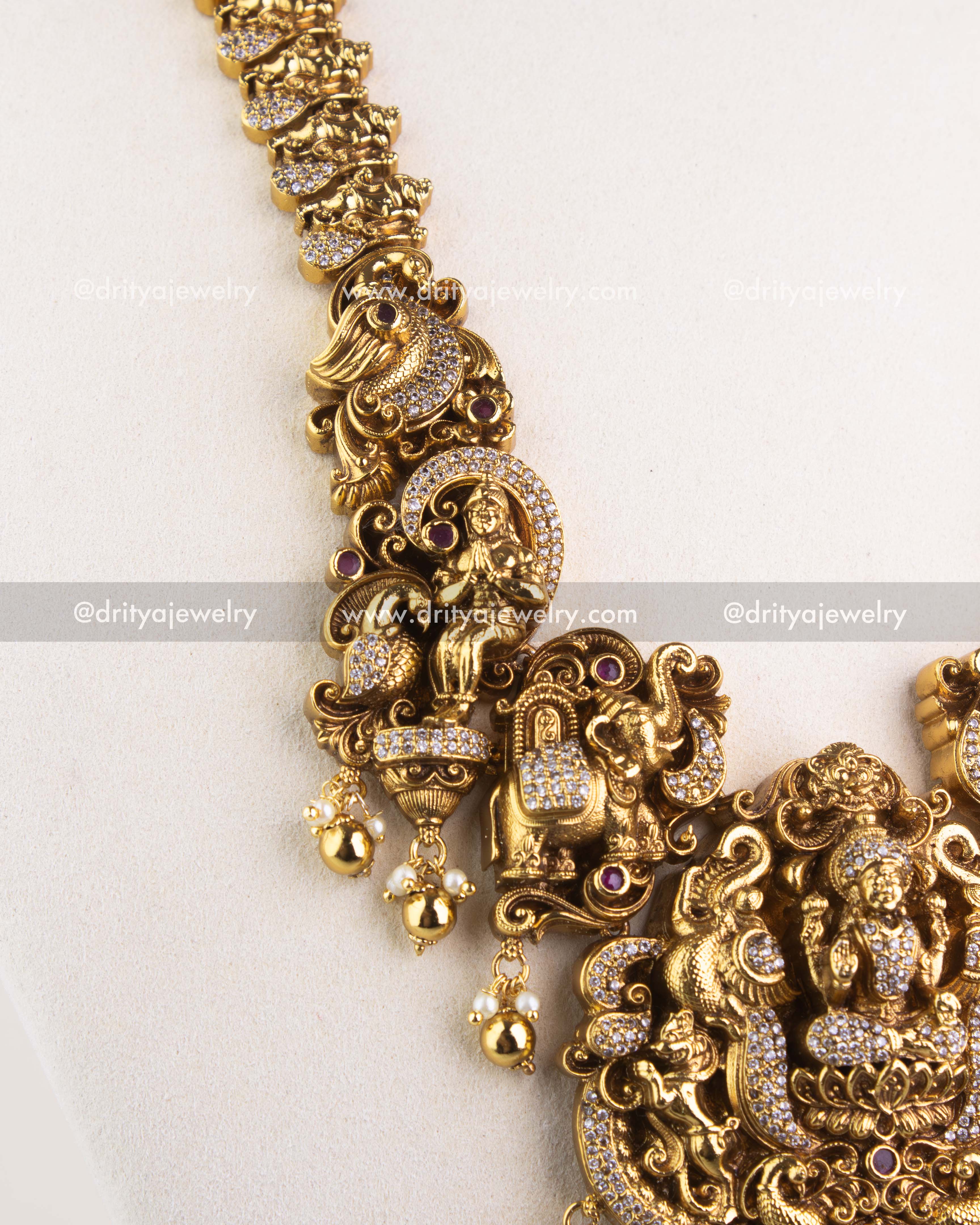1253 - Side detail of temple necklace showing sculpted figurines and stone-studded work