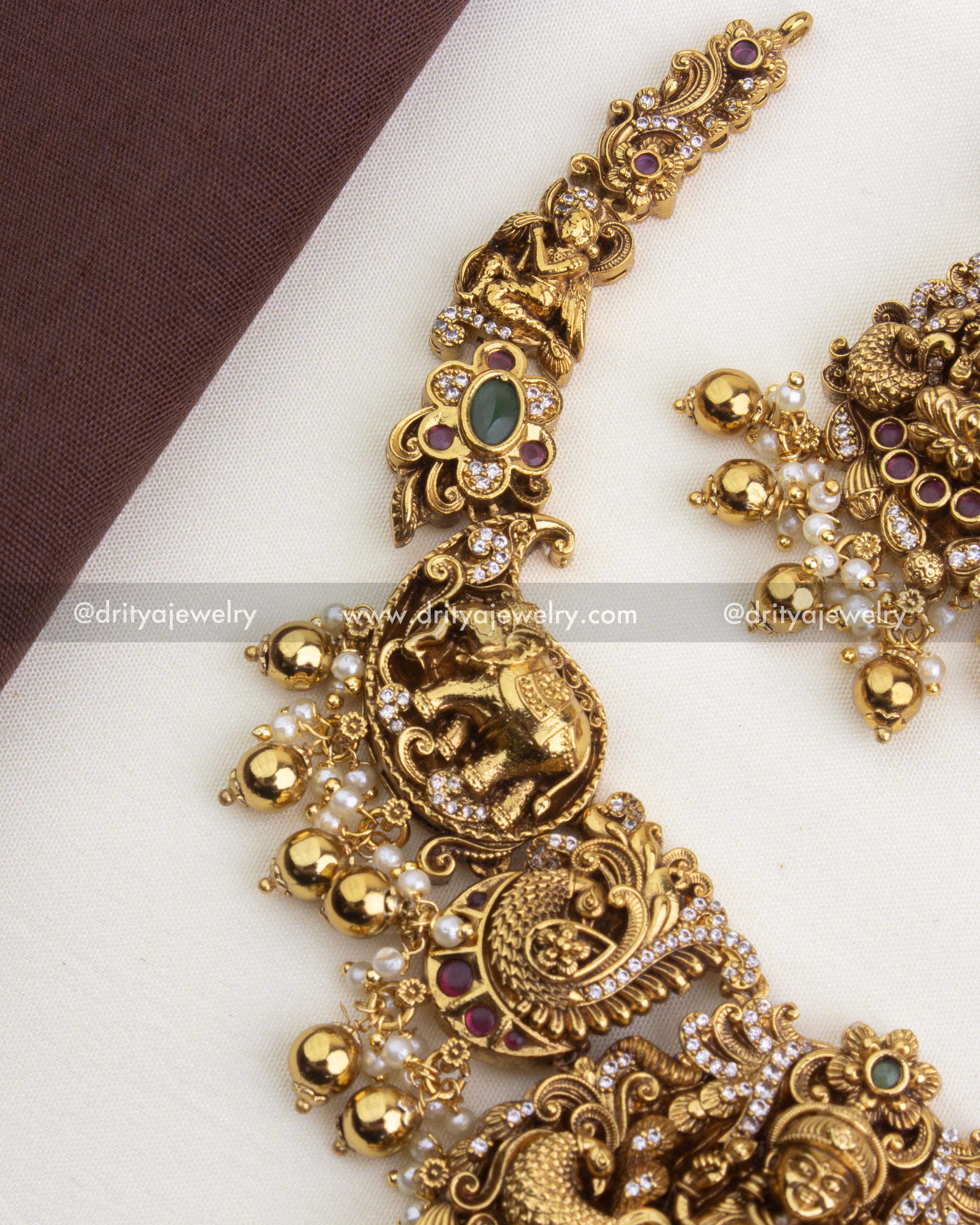 SKU 1250 side view of temple necklace showing elephant and peacock motifs with bead drops