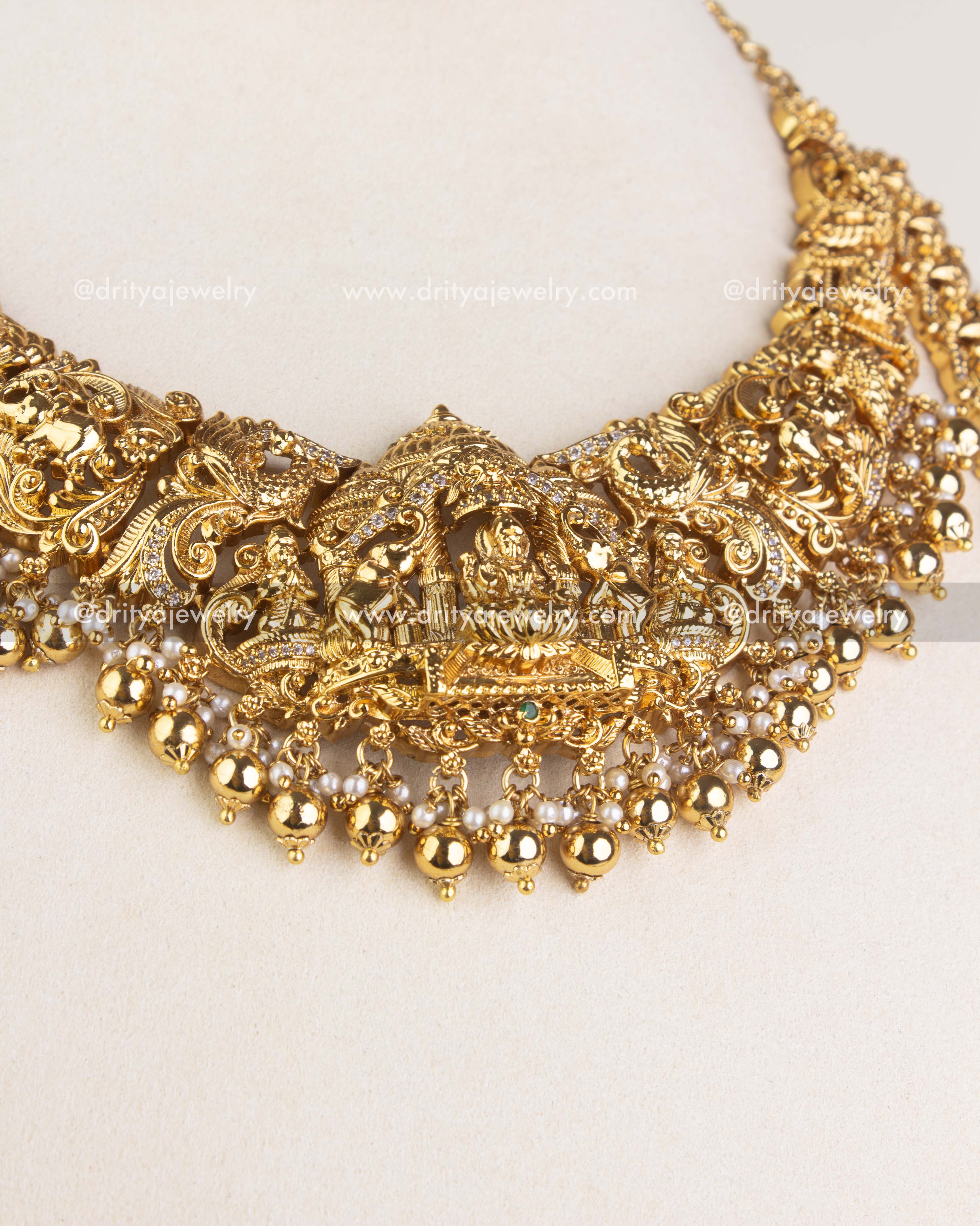 SKU 1124 - Necklace Set - Angled view highlighting intricate god idol centerpiece and hanging beads.