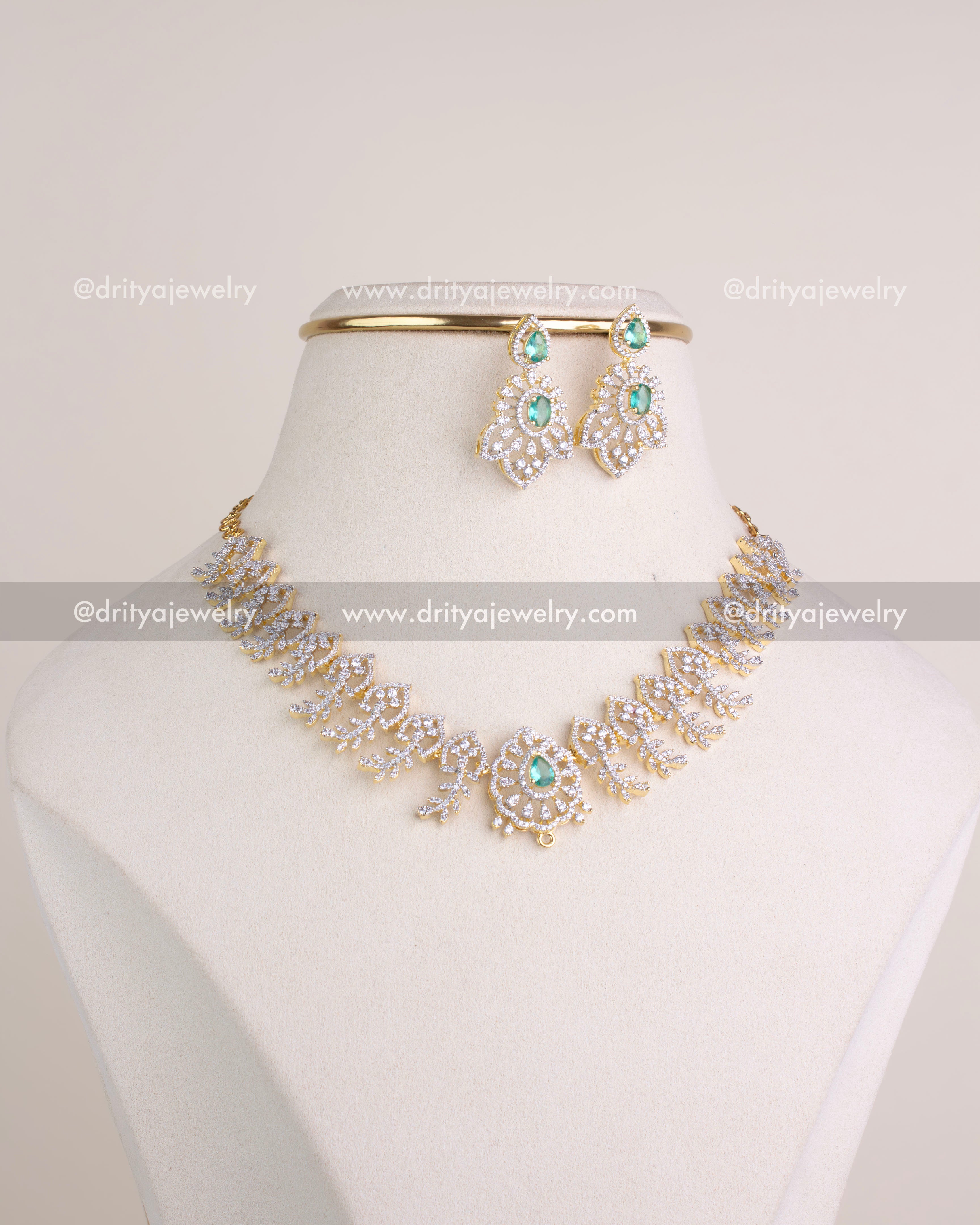 1232-RE short necklace set with earrings and smaller center motif on bust stand