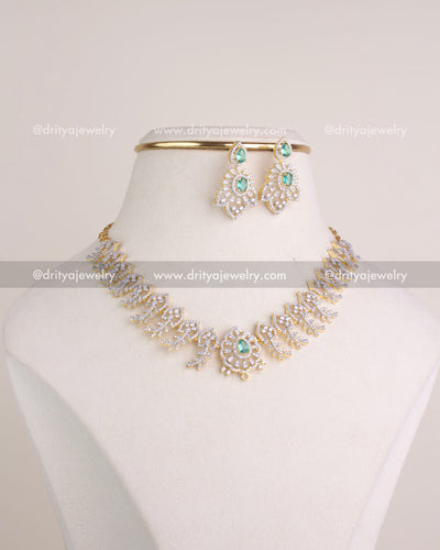 1232-RE short necklace set with earrings and smaller center motif on bust stand
