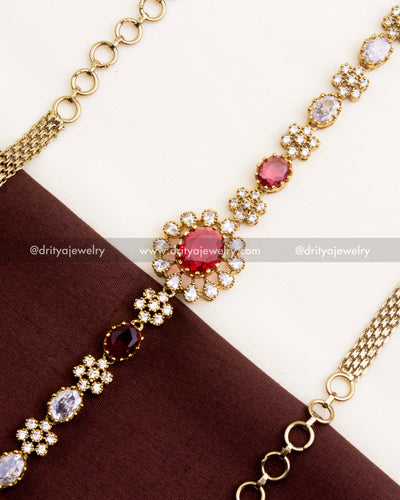 1109-R Victorian hip chain mid view showing red centre stone and CZ detailing