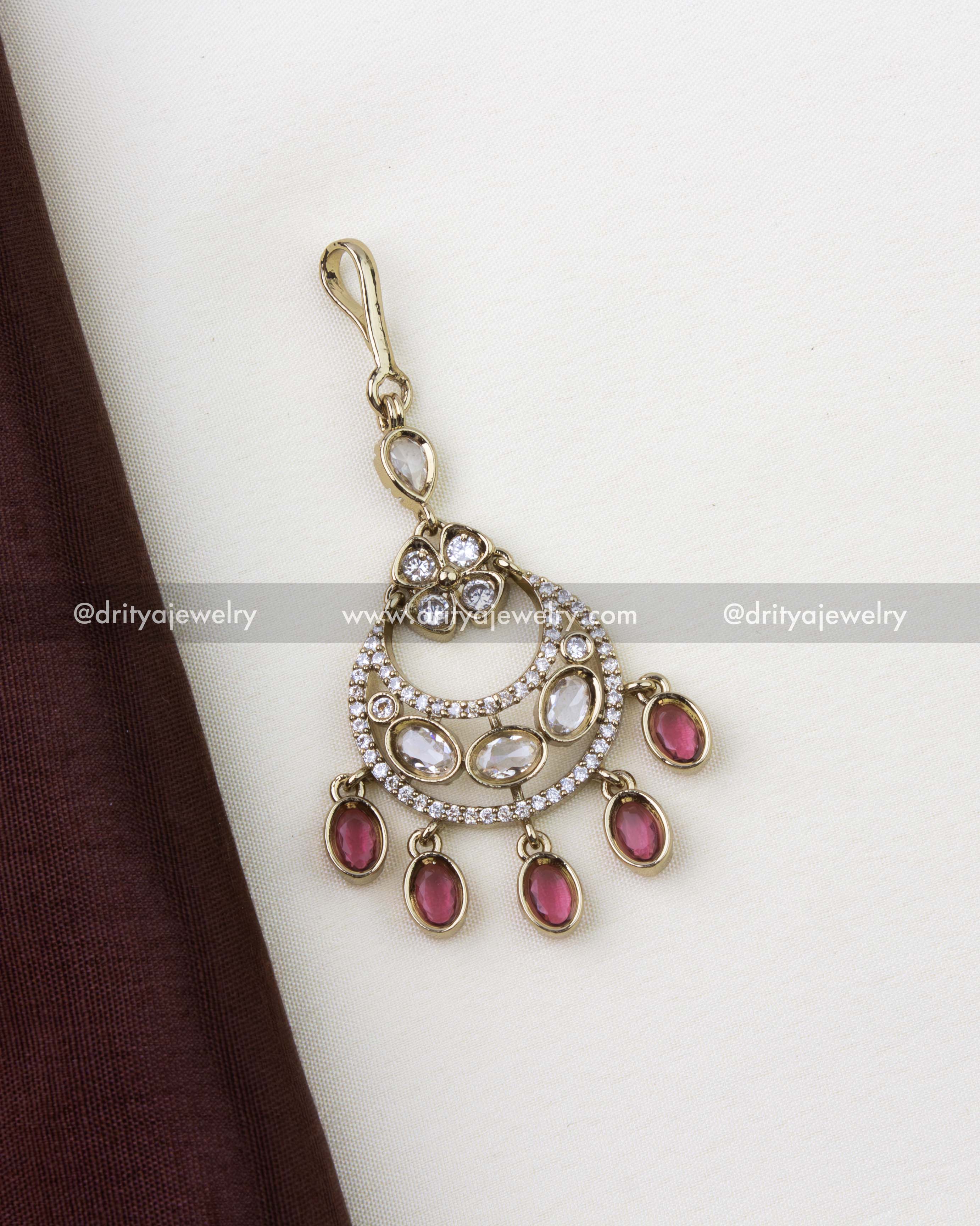 1260-R Victorian style gold-toned maang tikka with white AD stones and red oval drops front view