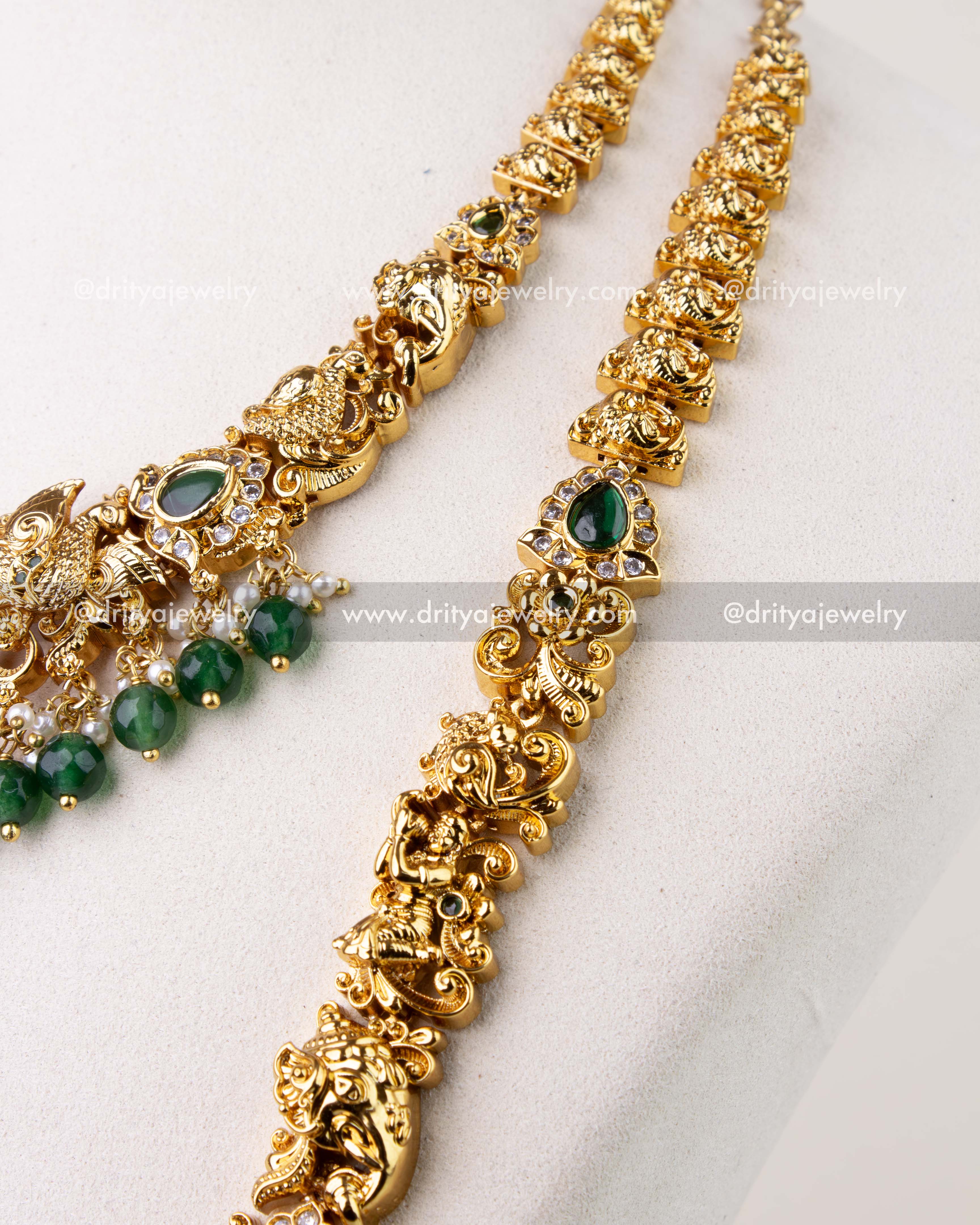1270-G temple necklace close-up showing antique gold links with green stone accents