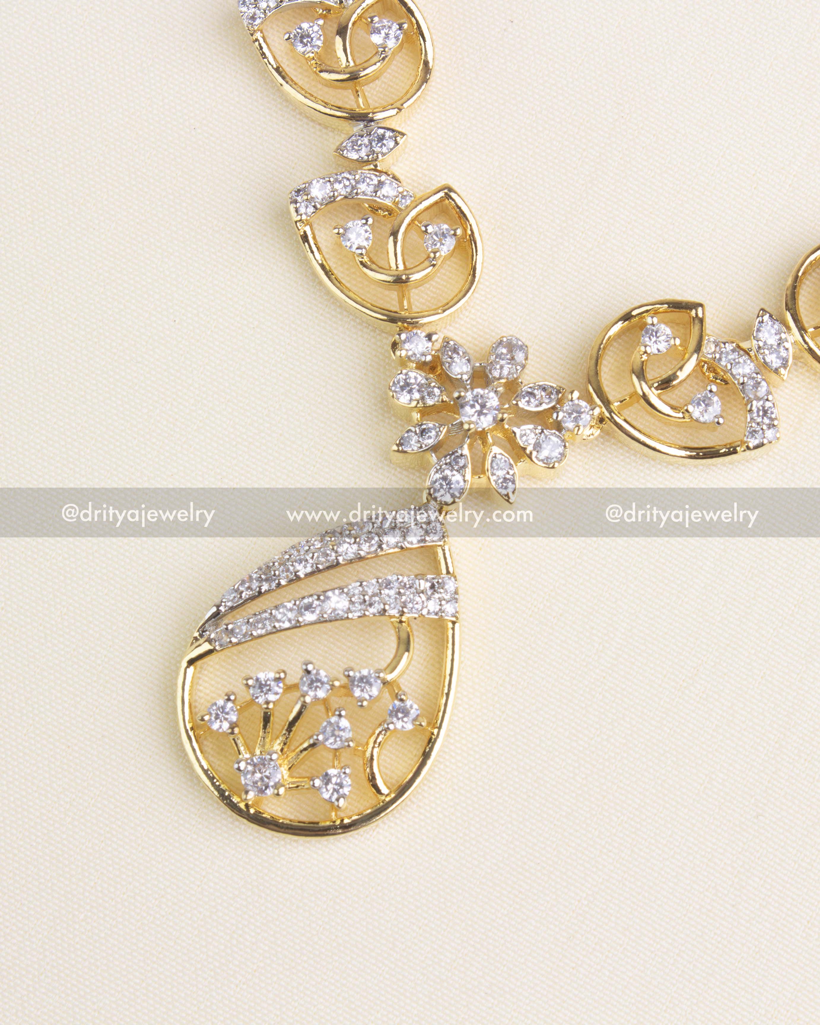 SKU 1180 - Close-up of necklace pendant with floral teardrop design