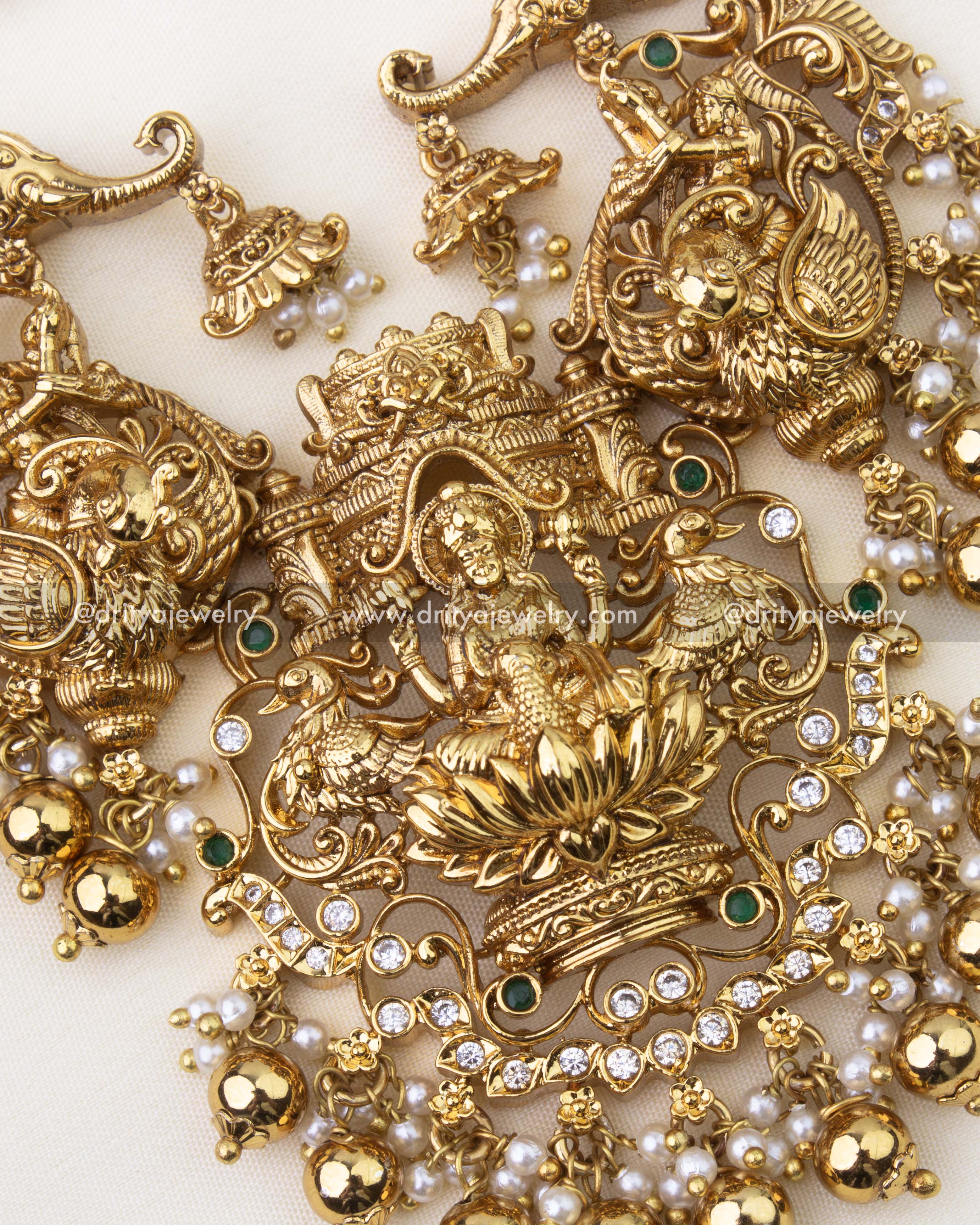 1263-GO detailed view of god idol pendant with lotus motif, stones and pearl clusters