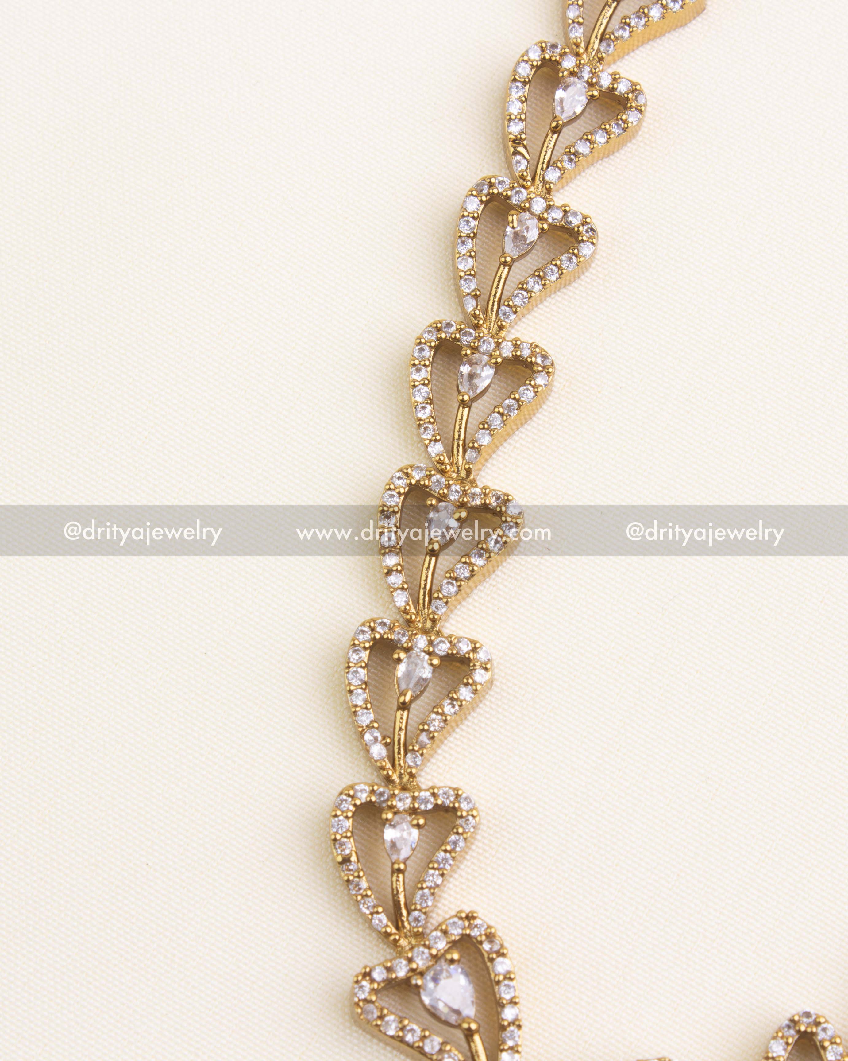 1152-BP - Necklace Set - Side close-up of antique gold heart links with clear stones