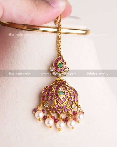 1201 - Necklace Set - Close-up of maang tikka with idol-style motif and pearl drops