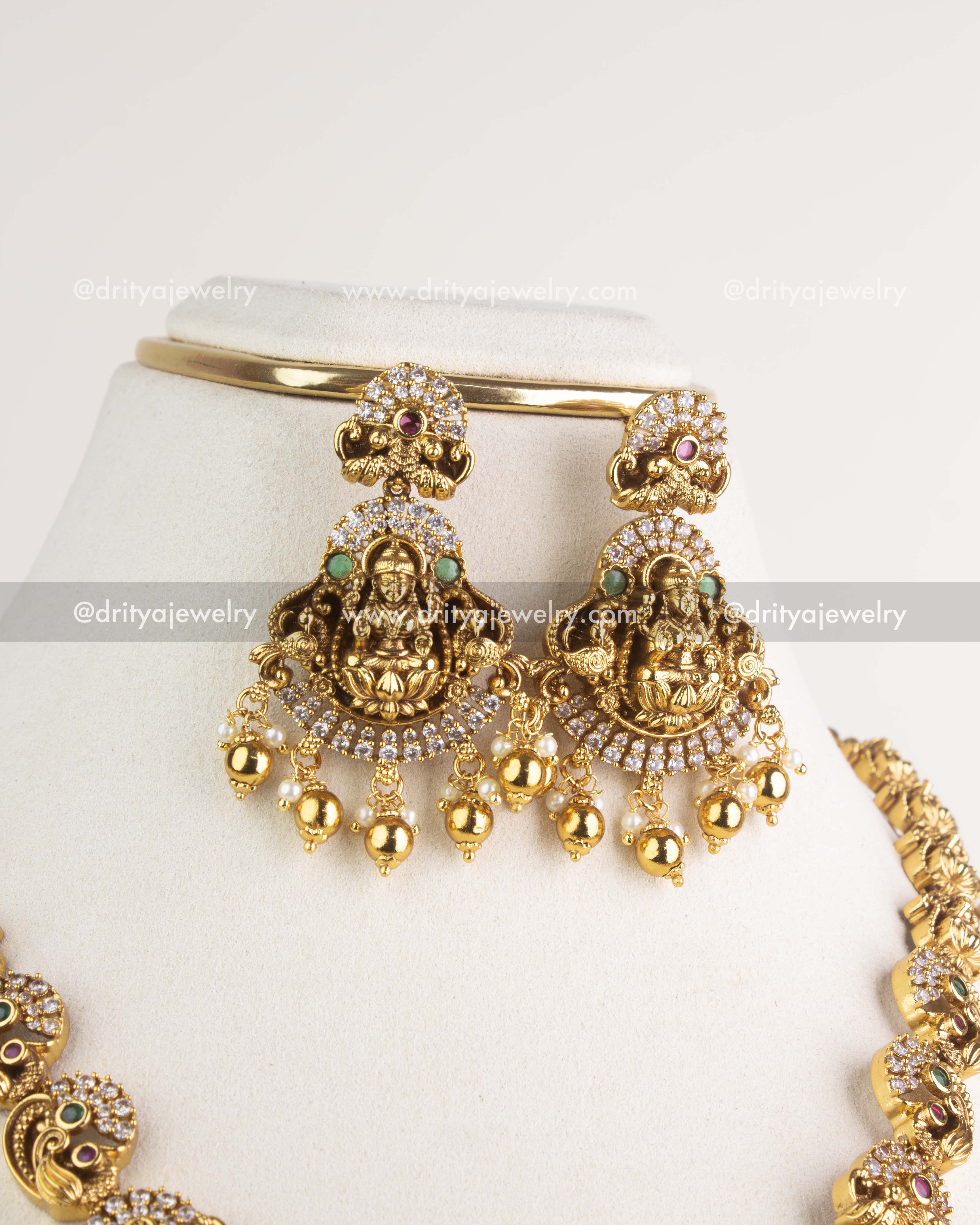SKU 1163 Necklace Set close-up of matching god idol earrings with stone-studded halo and drops