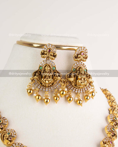 SKU 1163 Necklace Set close-up of matching god idol earrings with stone-studded halo and drops