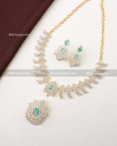 1232-RE premium diamond replica necklace set with detachable green stone pendant and earrings laid flat