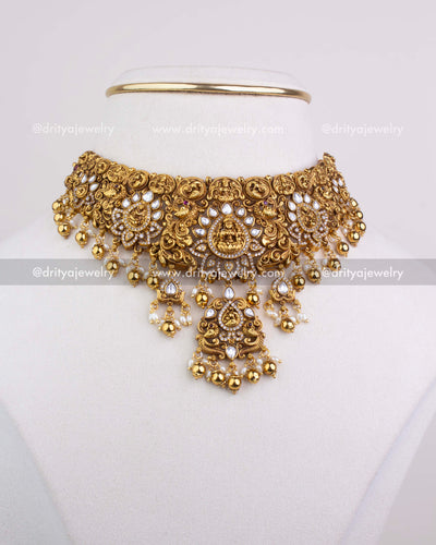SKU 1251 full front view of antique gold temple choker necklace set on display