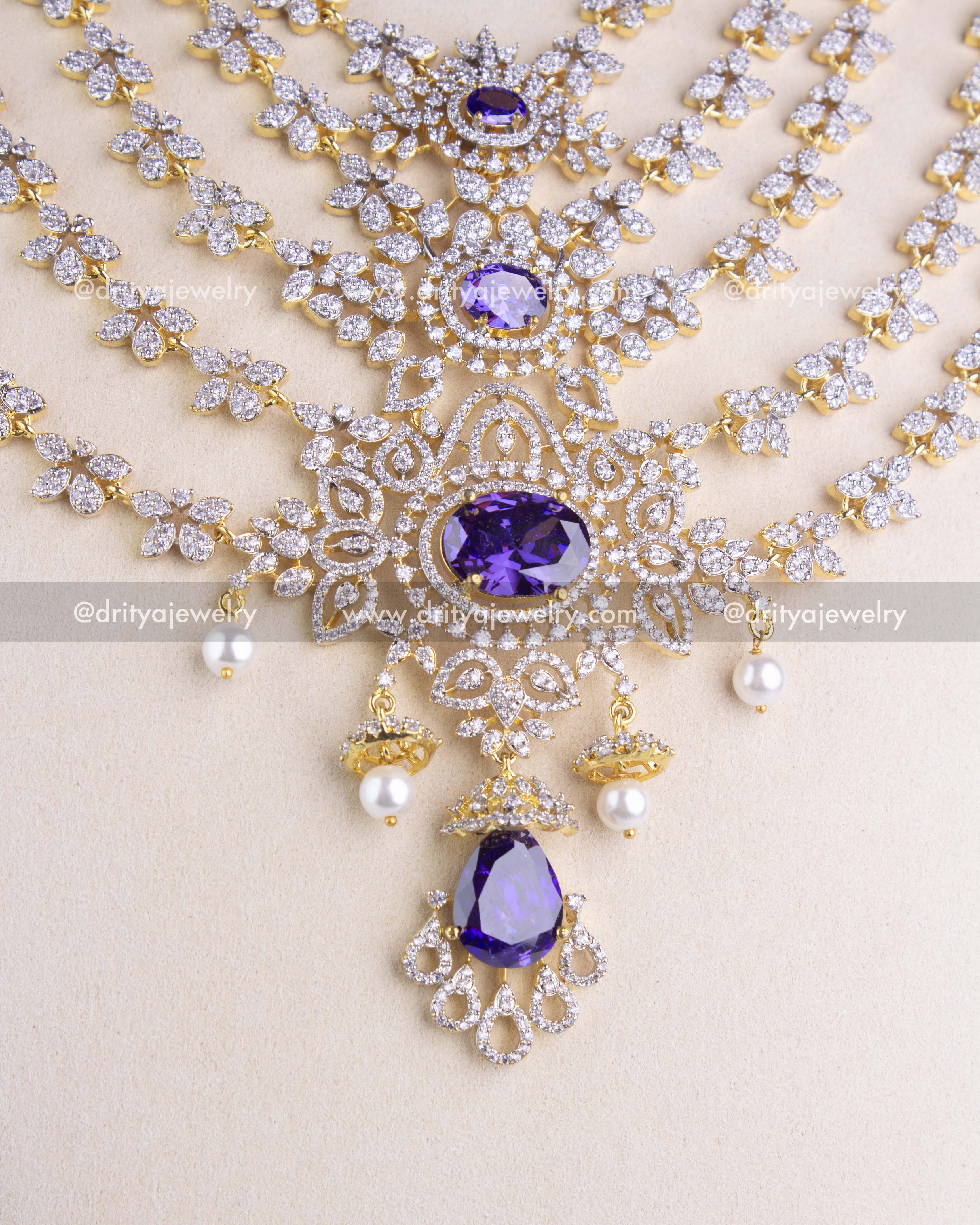 1230 - Close-up of central pendant with purple stones, CZ detailing and pearl drops