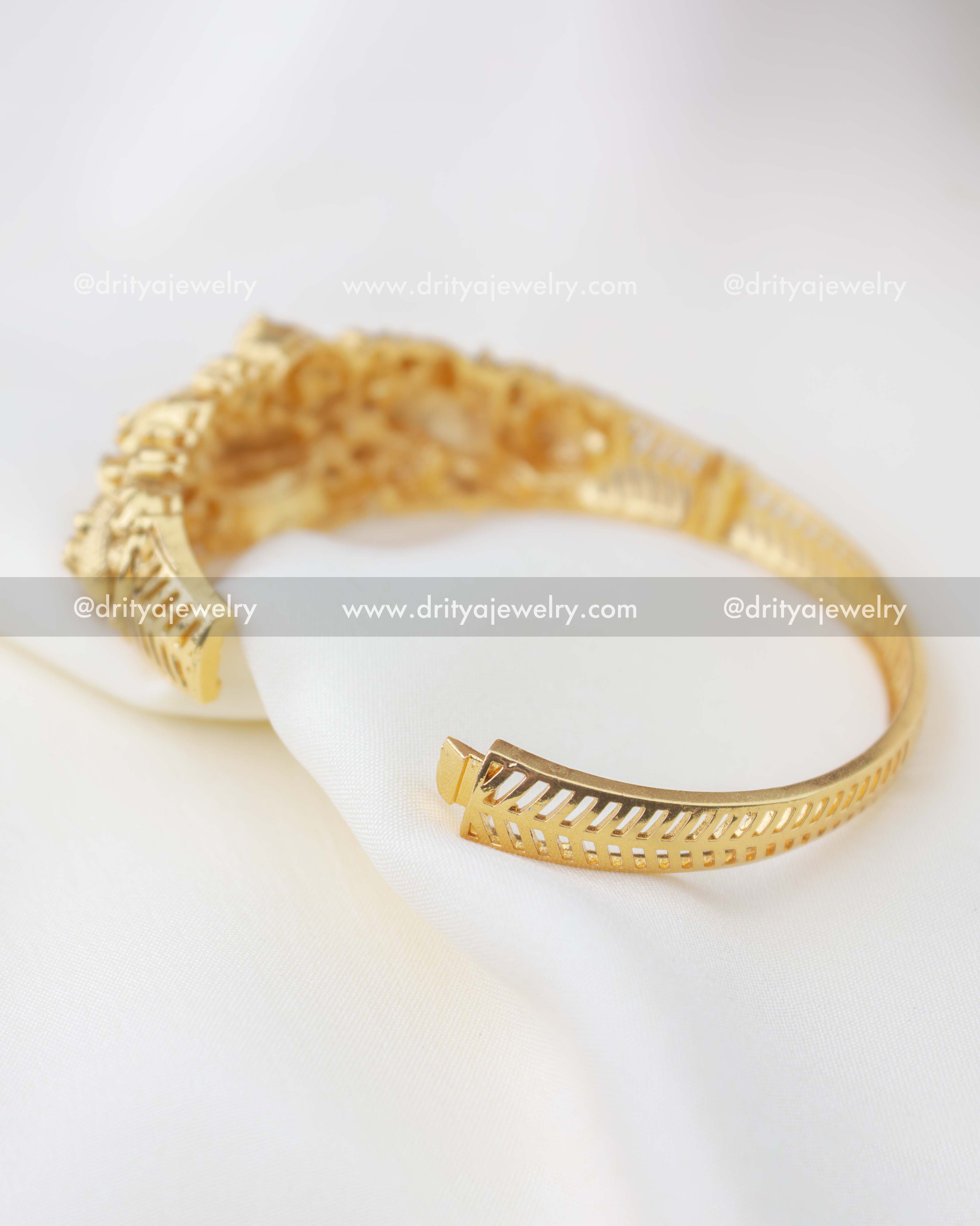 1298 - Openable gold replica kada showing inner band and hinge mechanism