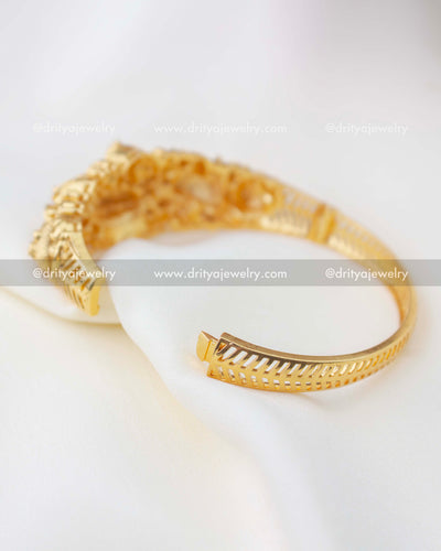 1298 - Openable gold replica kada showing inner band and hinge mechanism