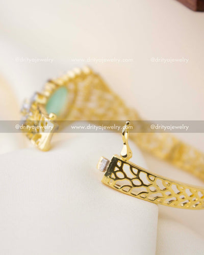 1295-MG openable kada showing hinge mechanism and cutwork gold band