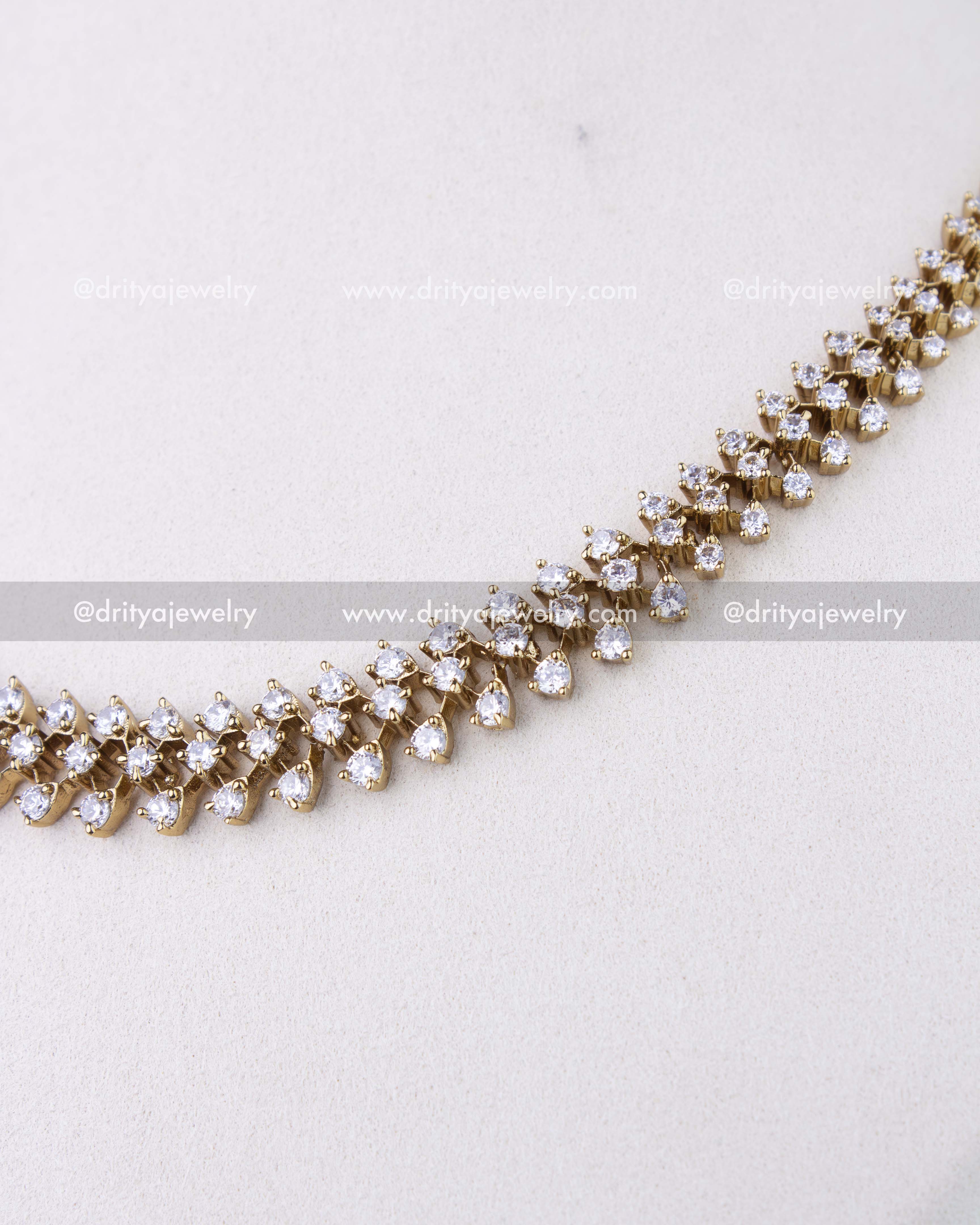 SKU 1304 - Detailed close-up of double-row CZ stone setting on necklace