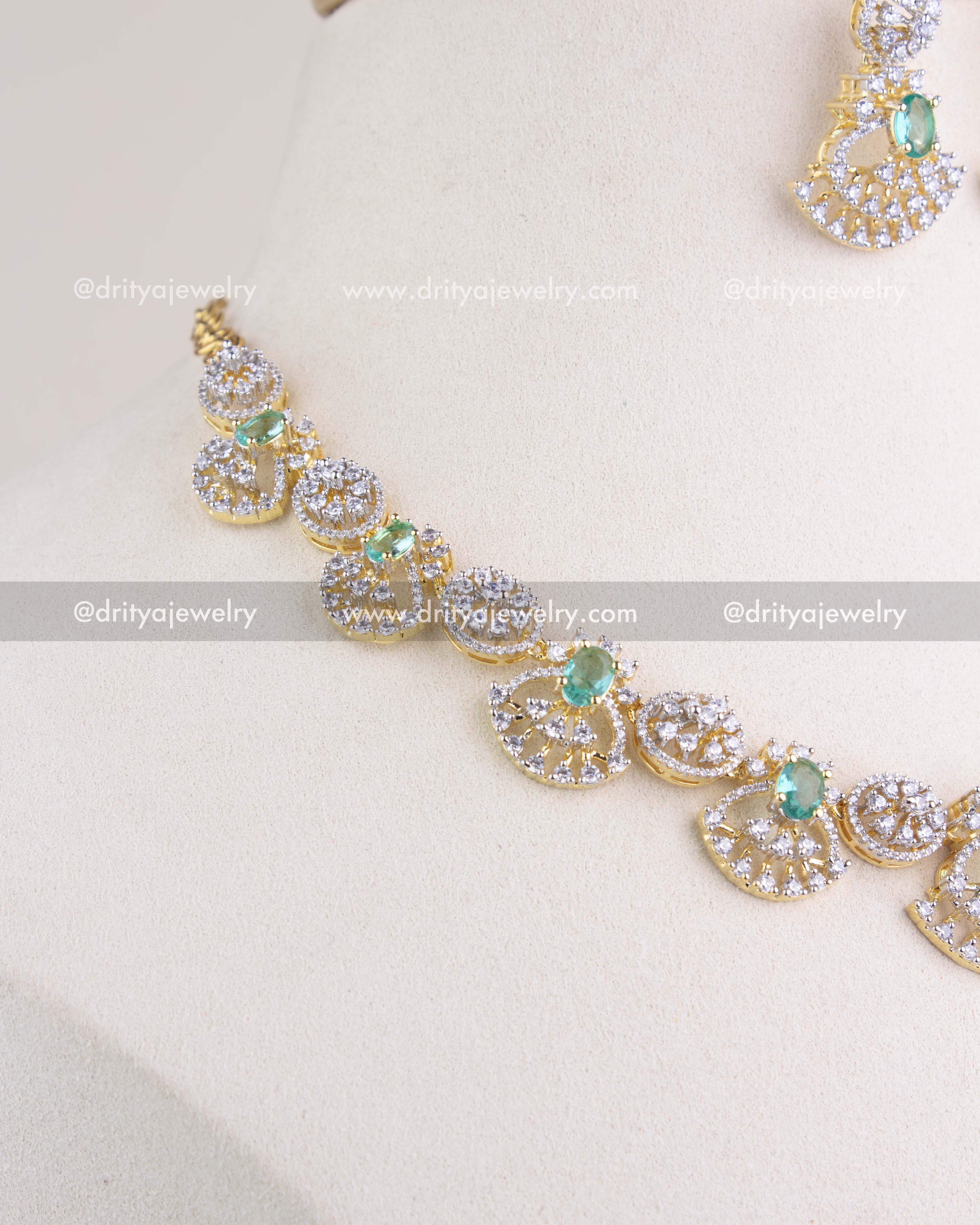 1211-RE side angle of CZ and emerald short necklace detailing