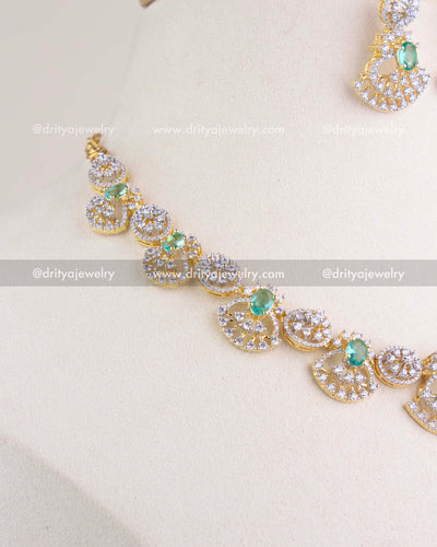 1211-RE side angle of CZ and emerald short necklace detailing