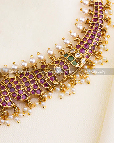 1202 - Close-up of short necklace band with ruby stones and pearl edging