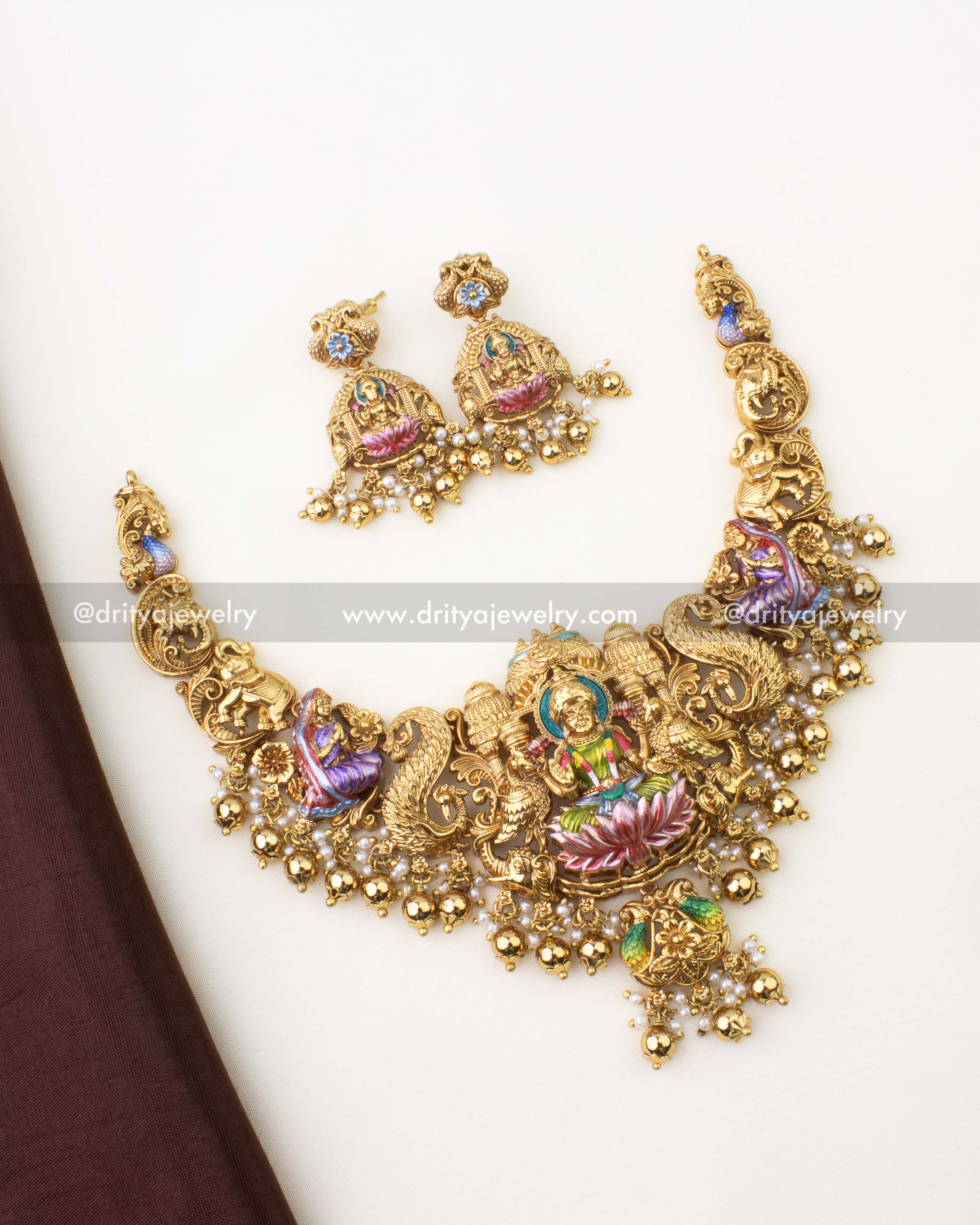 SKU 1262 - Complete Lakshmi temple short necklace set with matching earrings laid flat