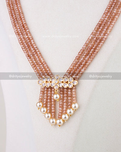 1281 - Front close-up of layered CZ bead necklace with kundan-style floral center and pearl drops