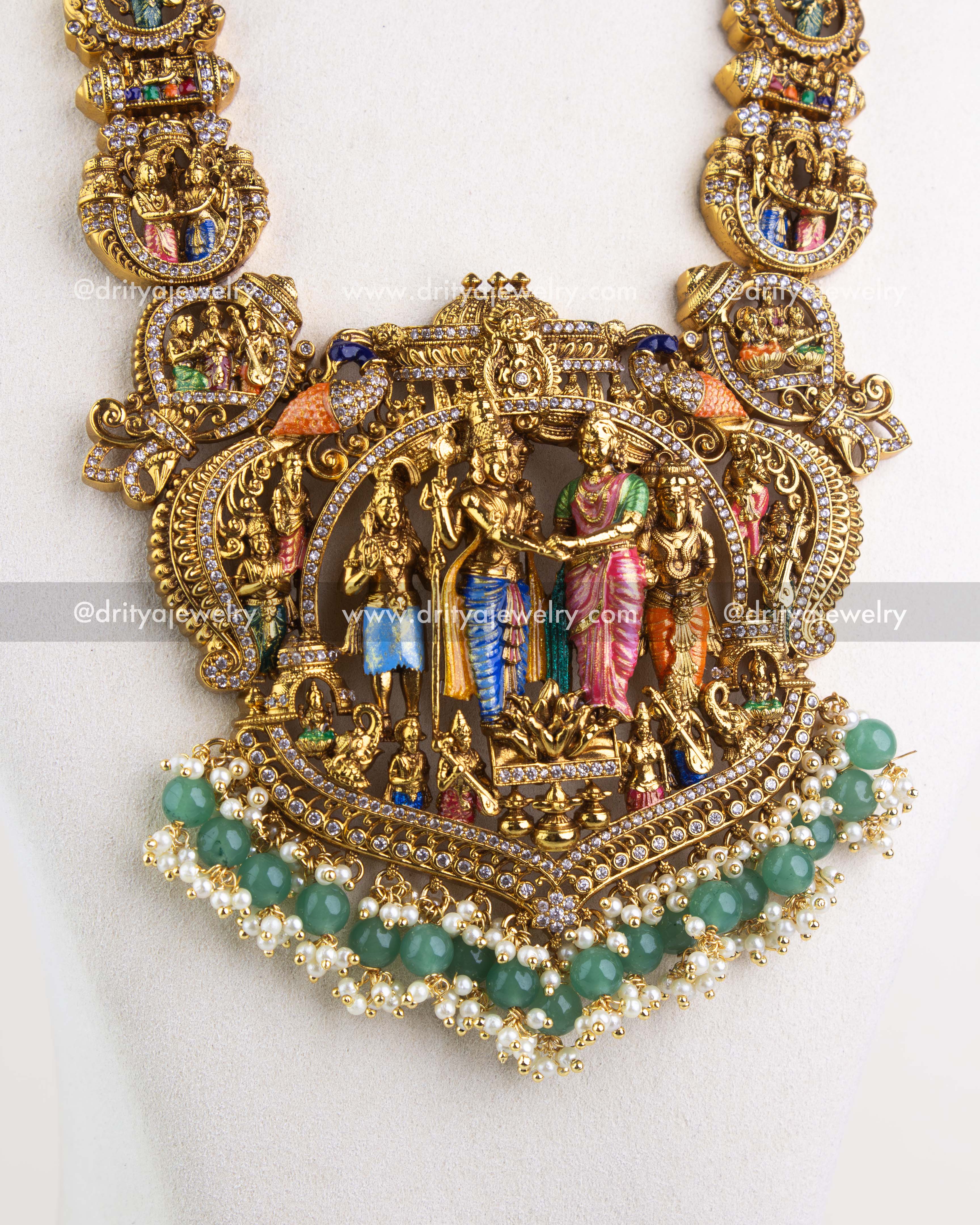 Central Srinivasa Kalyanam pendant with sculpted idols and green bead fringe