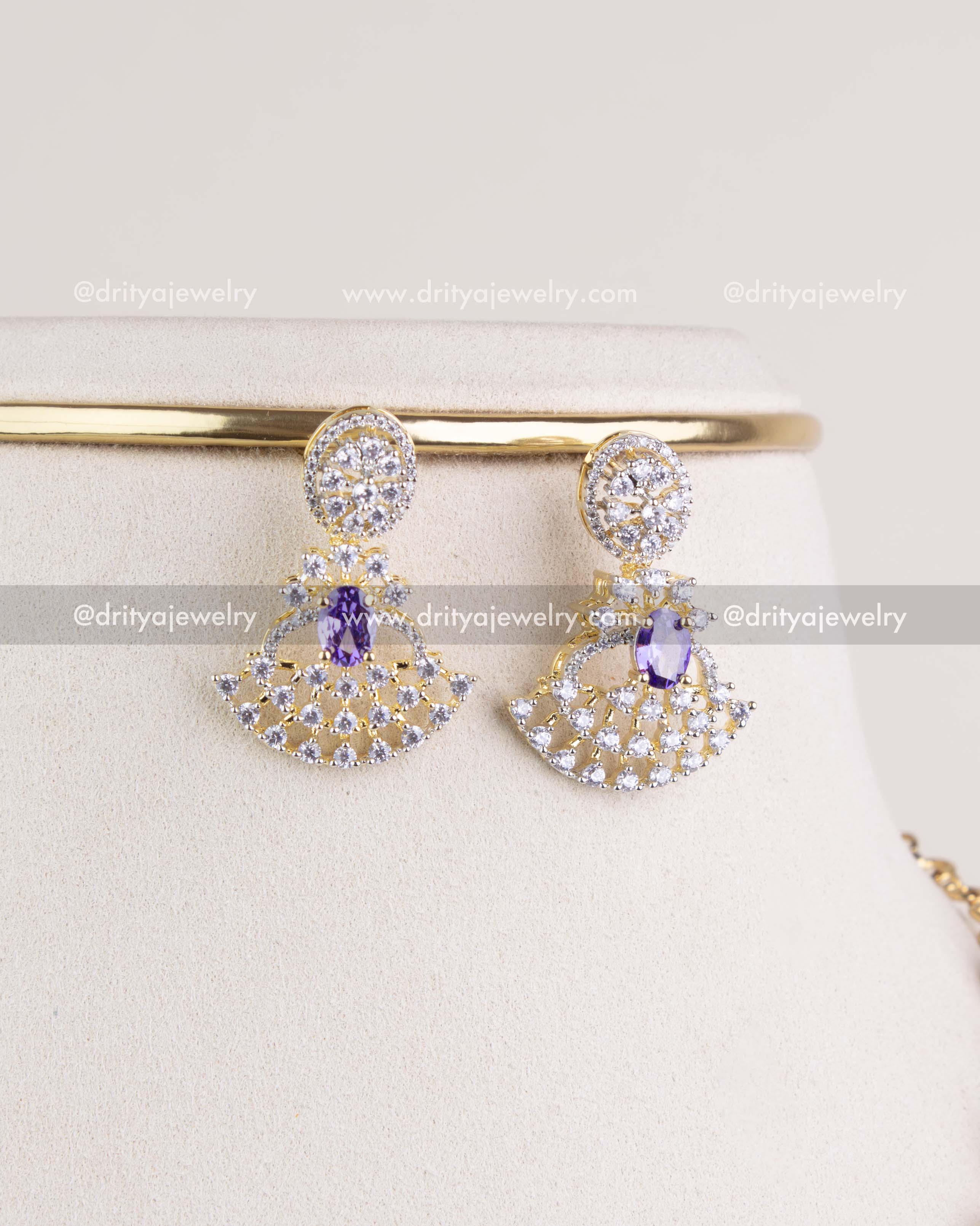 1211-PU matching CZ and purple stone fan motif earrings close-up view