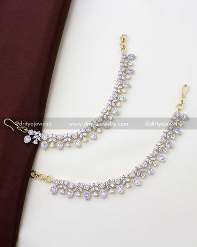 1273-G pair of floral stone-studded anklets laid flat full view