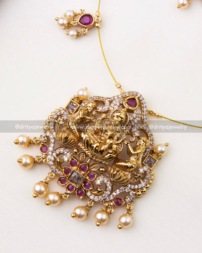 1216-R close-up of Lakshmi temple pendant with ruby stones and pearl danglers