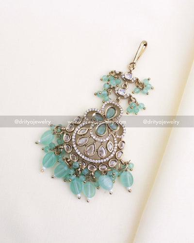 610-MG Victorian maang tikka with mint green beads, full front view on fabric background