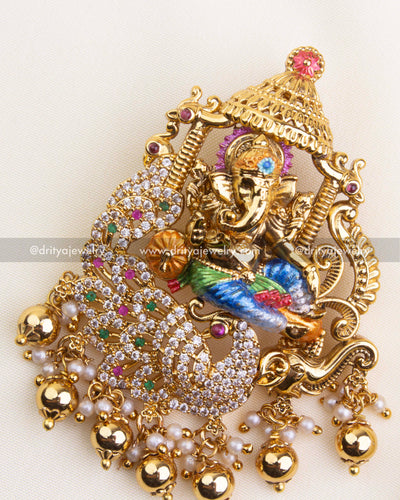 SKU 1116 close-up of Ganesha pendant highlighting CZ stones, peacock motif and gold finish