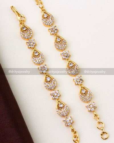 1302-W premium gold matilu hair chain close-up showing teardrop and floral CZ motifs