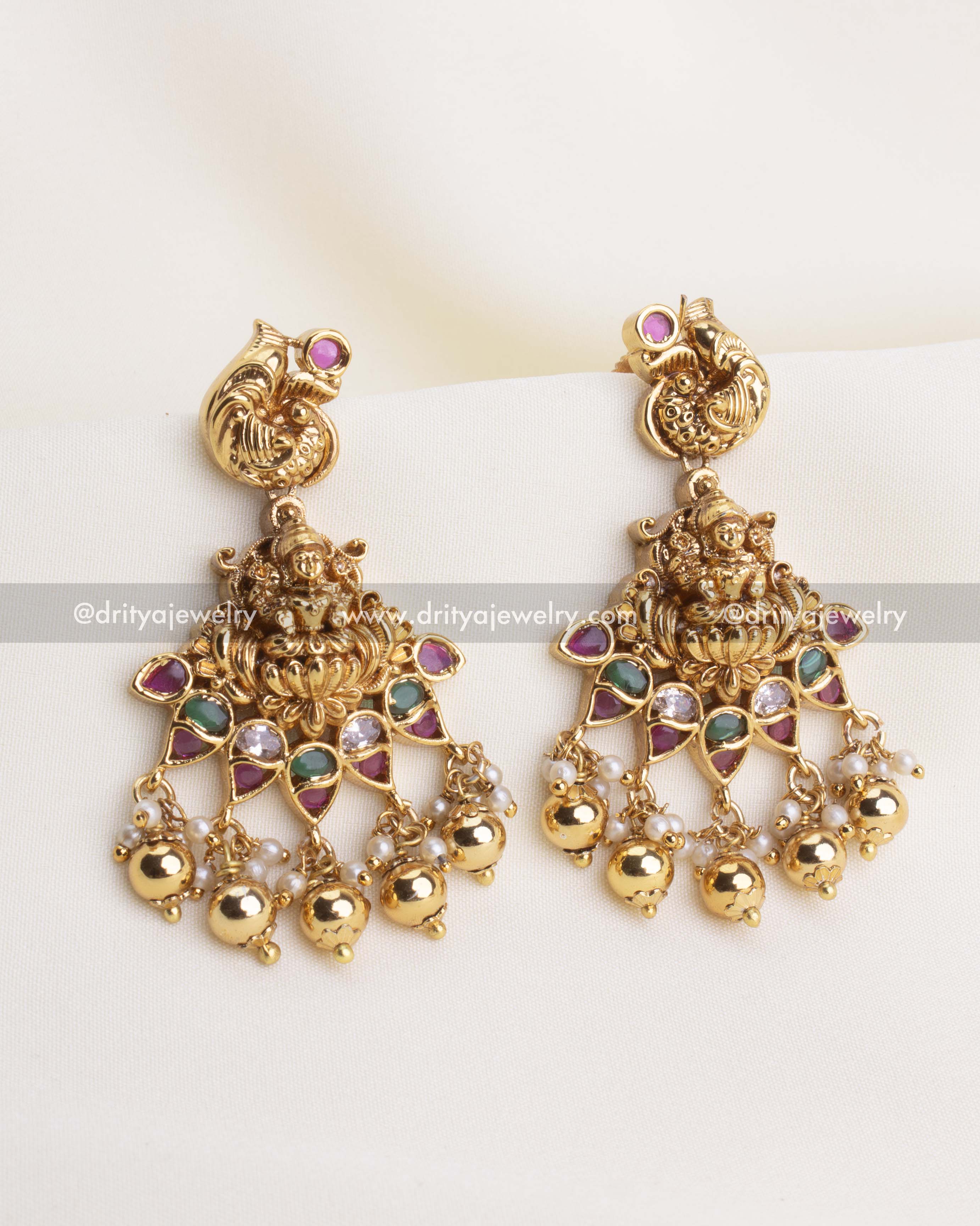 SKU 1105 Necklace Set - Close-up front view of temple-style god idol earrings with coloured stones and ghungroo drops